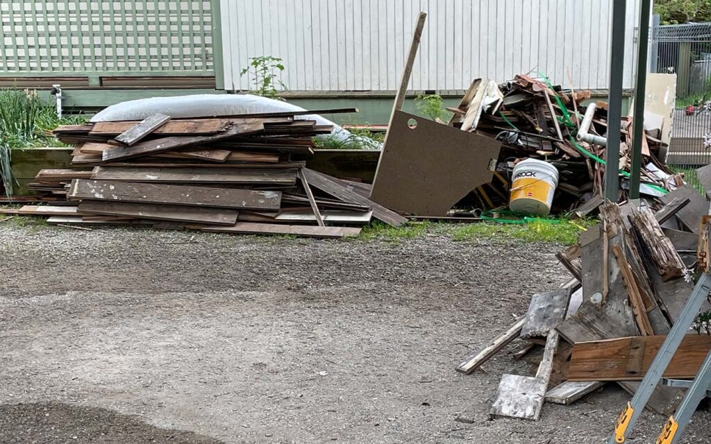 Piles of rubbish and rotten floorboards