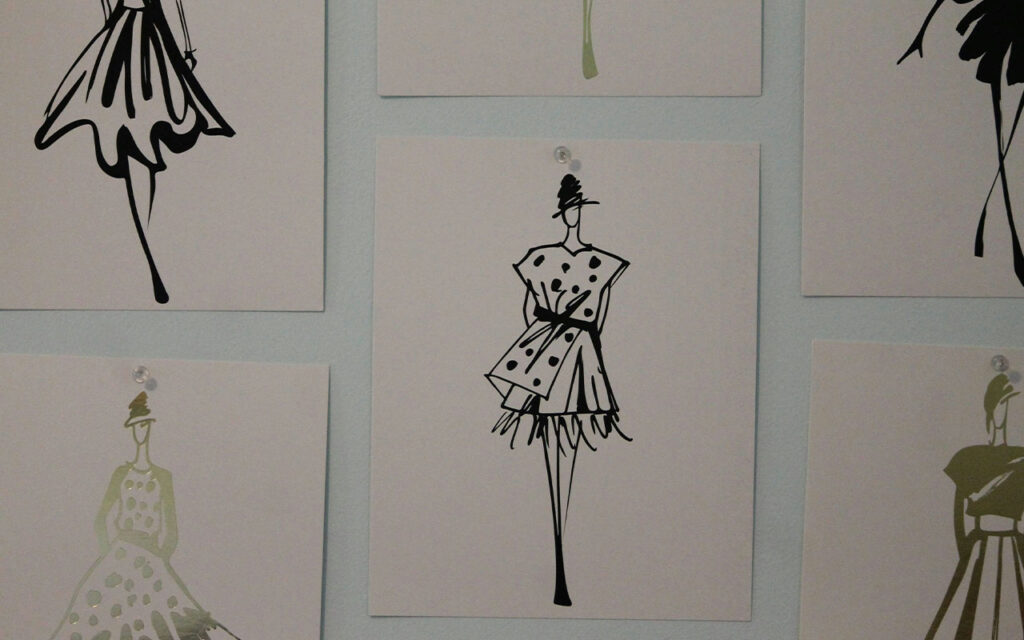 posters of dress silhouettes on the wall representing the 2025 summer wardrobe plan